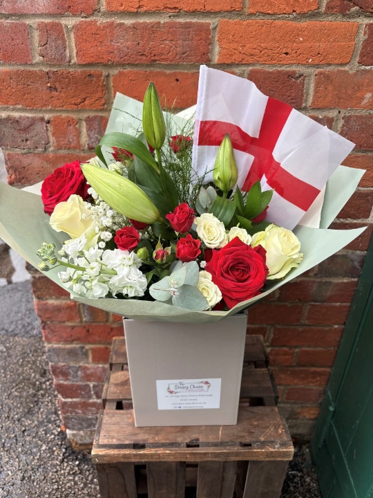 England World Cup football bouquet featuring red roses, white lilies, and an England flag in a gift box by The Daisy Chain.